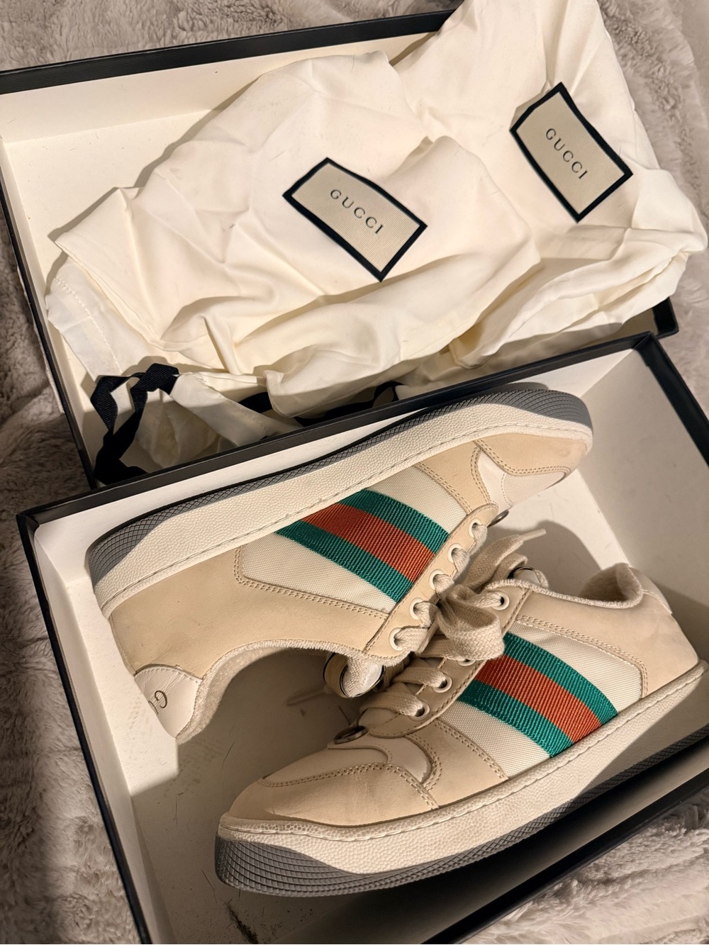Authentic Gucci Ace women’s sneakers with iconic green and red stripe.